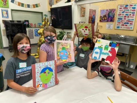 a group of children wearing masks
