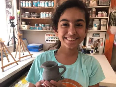 a person holding a coffee cup