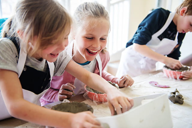 a group of girls making a project