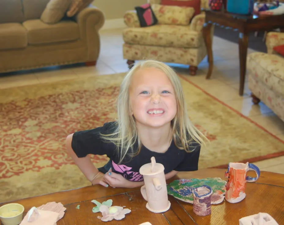 a girl sitting at a table