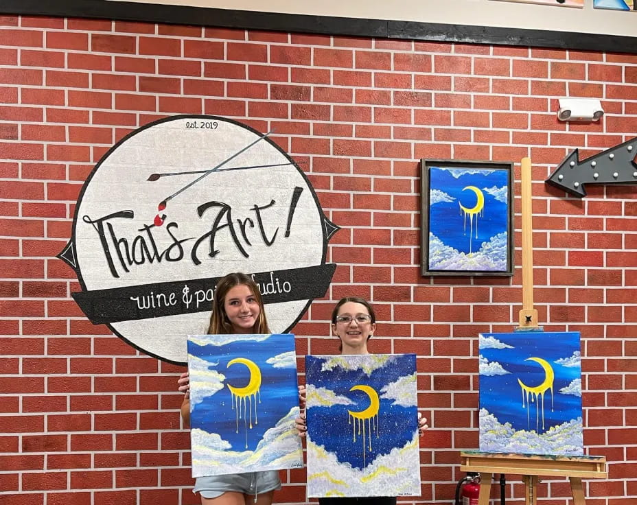 a couple of people holding posters