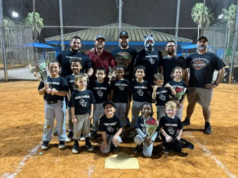 a group of kids pose for a photo