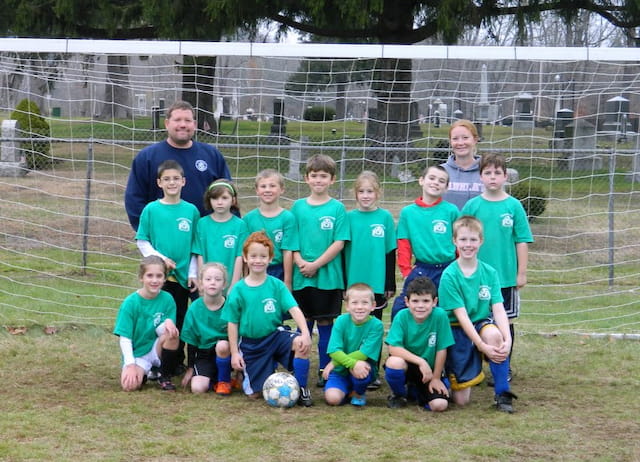 a group of kids posing for a picture