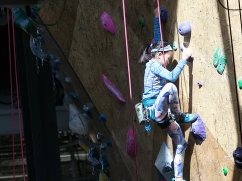 a person climbing a rock wall