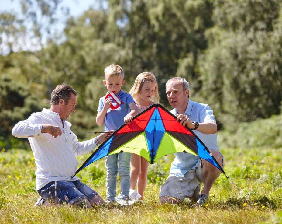 a family with a kite