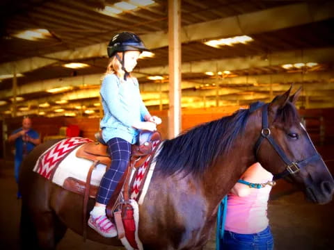 a girl riding a horse