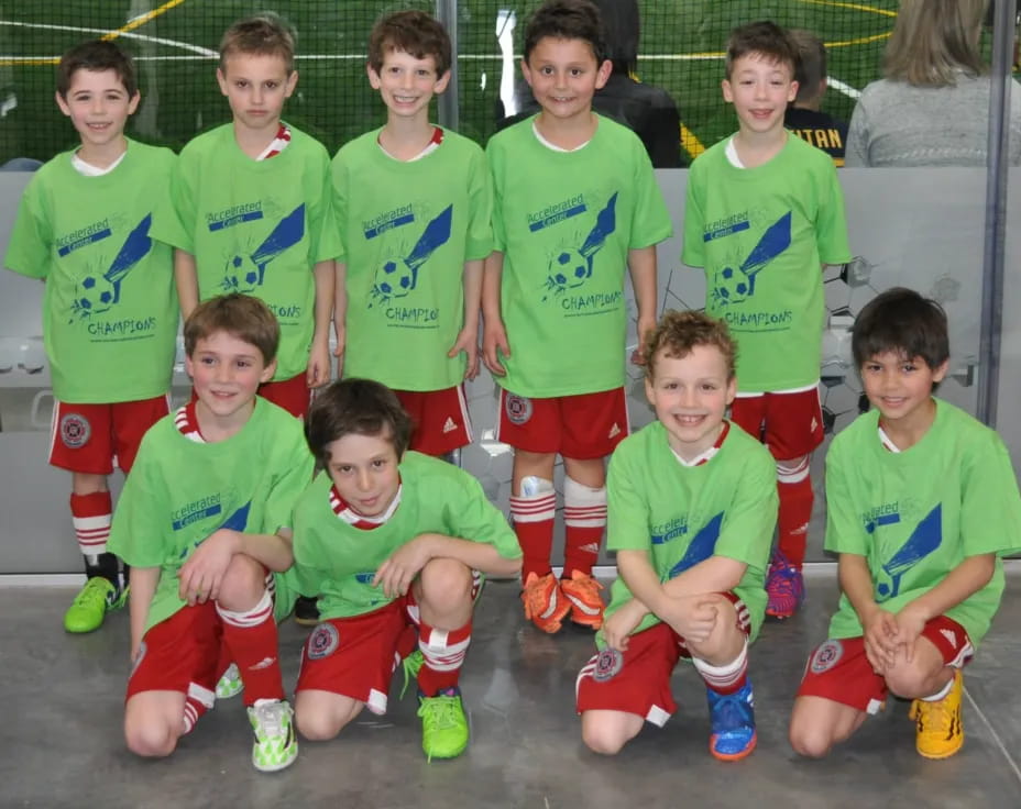 a group of kids in green uniforms