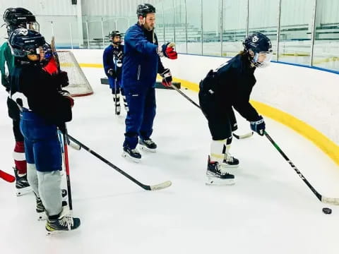 a group of people playing hockey