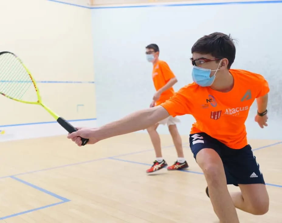 a boy playing tennis