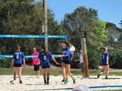 a group of girls playing football