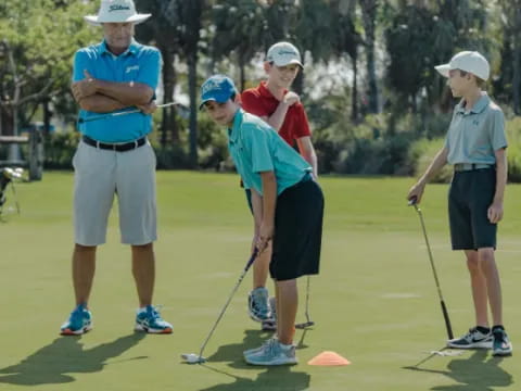 a group of people playing golf