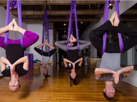 a group of people doing yoga