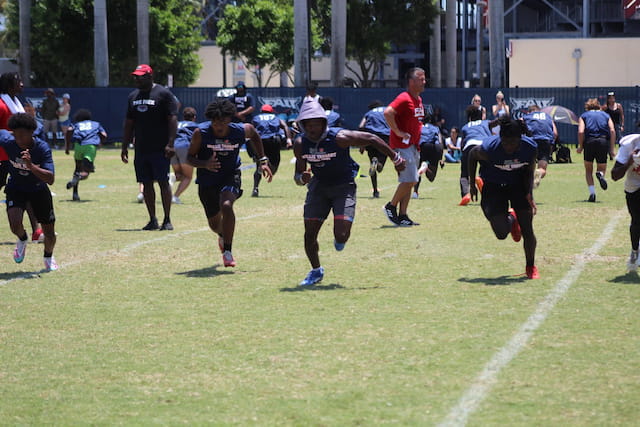 a group of people running on a field