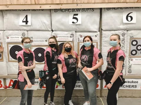 a group of people wearing masks