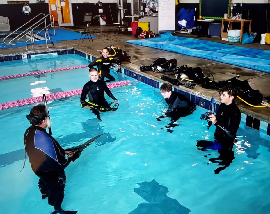 a group of people in a pool