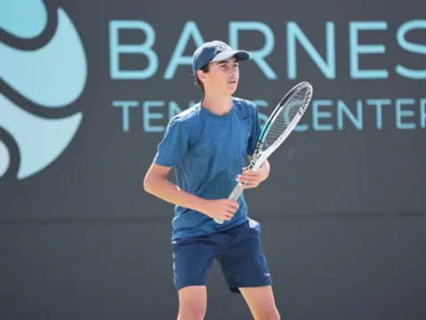 a person holding a tennis racket