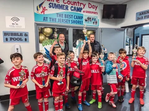 a group of boys in red uniforms