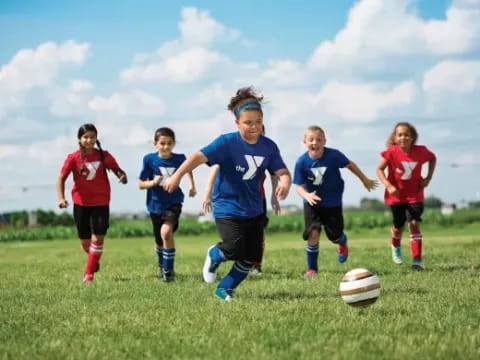 a group of kids playing football
