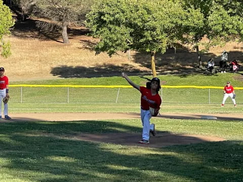 a kid throwing a baseball