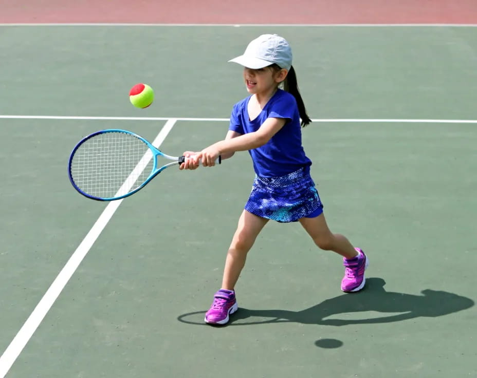 a girl playing tennis