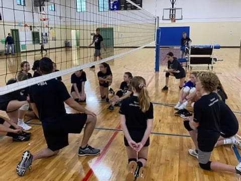 a group of people in a gym