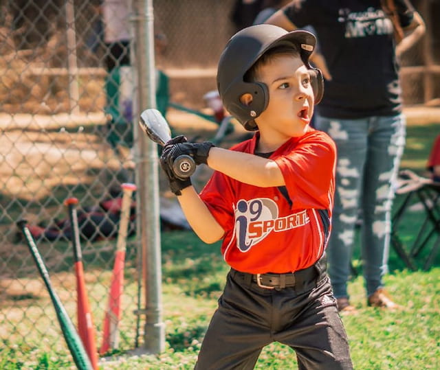 a young boy playing baseball