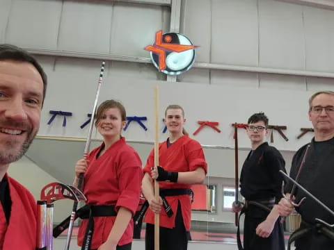 a group of people holding swords