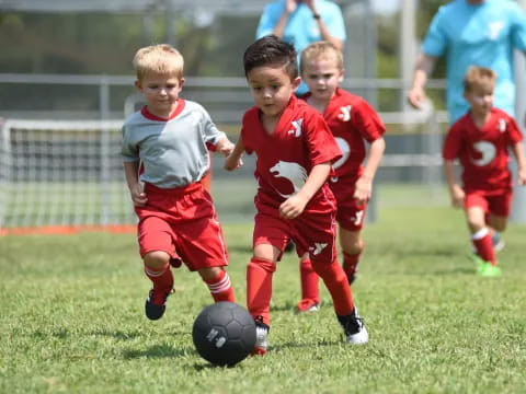 kids playing football on a field