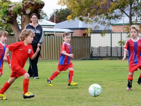 kids playing football on a field