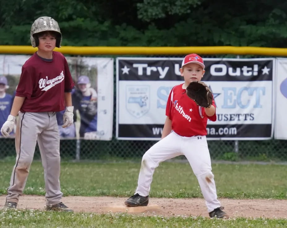 a couple of kids playing baseball