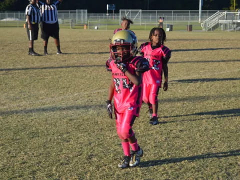 a group of kids in football gear