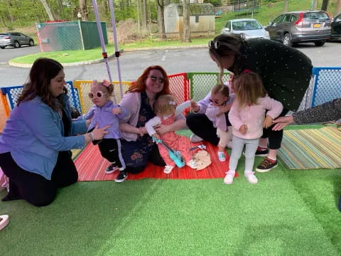a group of people on a swing