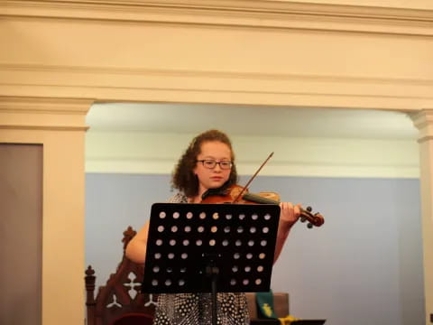 a person playing a violin