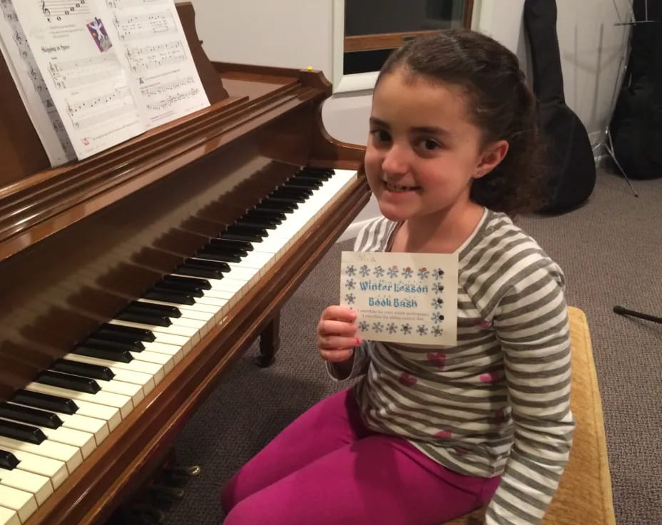 a girl holding a sign