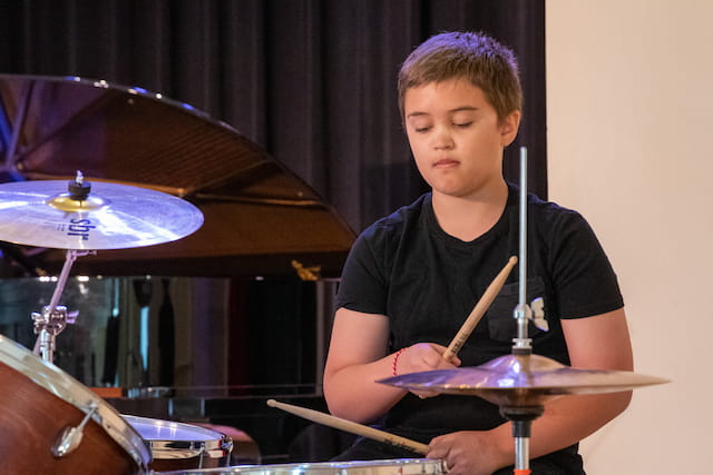 a boy playing drums