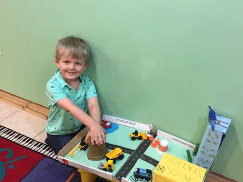 a boy playing with toys