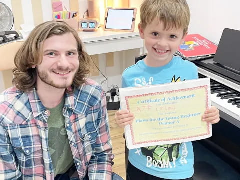 a person and a boy holding a sign