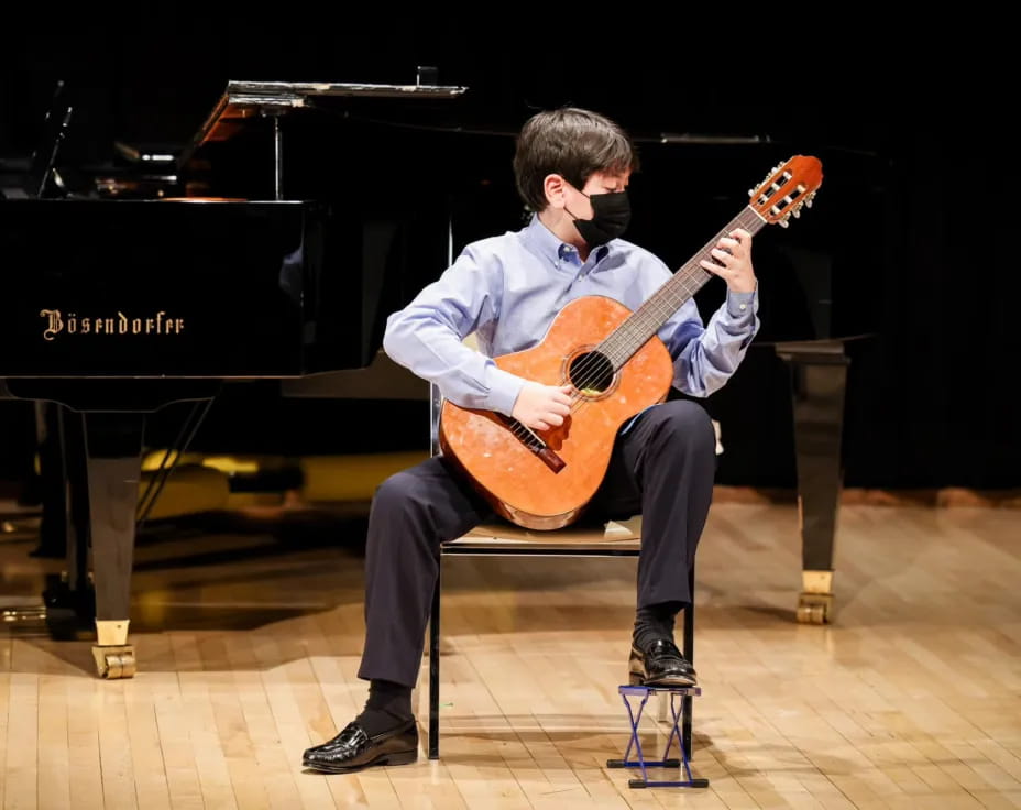 a man playing a guitar