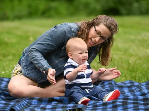 a person holding a baby