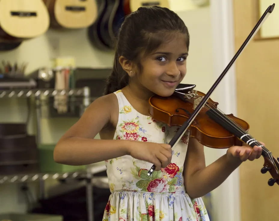 a girl playing a violin
