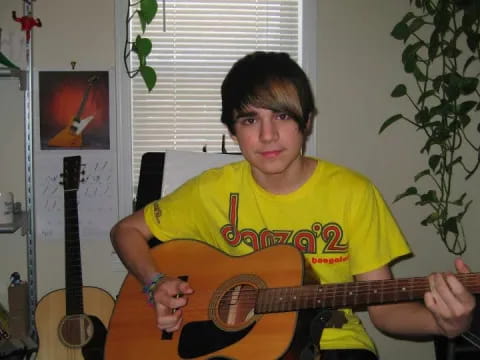 a man holding a guitar