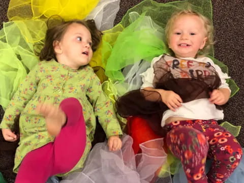 two children sitting on a couch