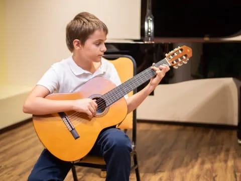 a person playing a guitar