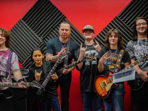 a group of people holding guitars