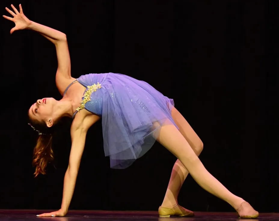 a woman dancing on a stage
