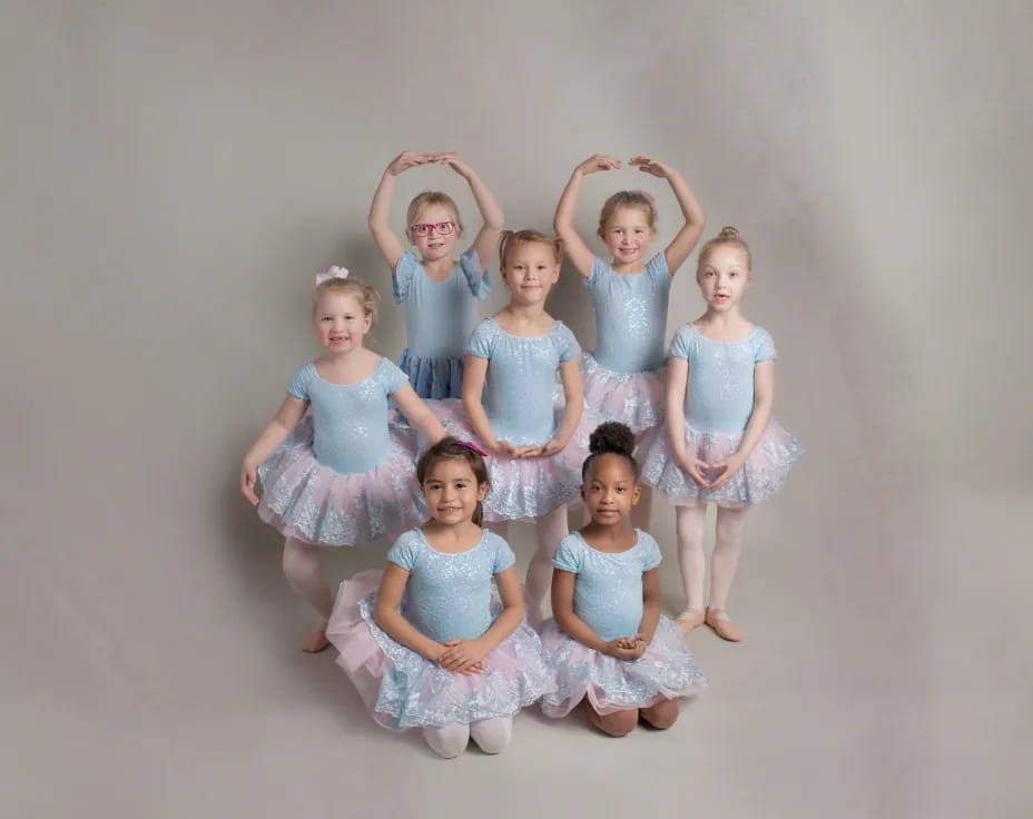 a group of girls in dresses