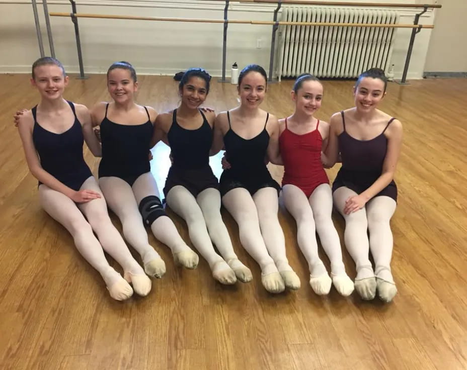 a group of women posing for a photo