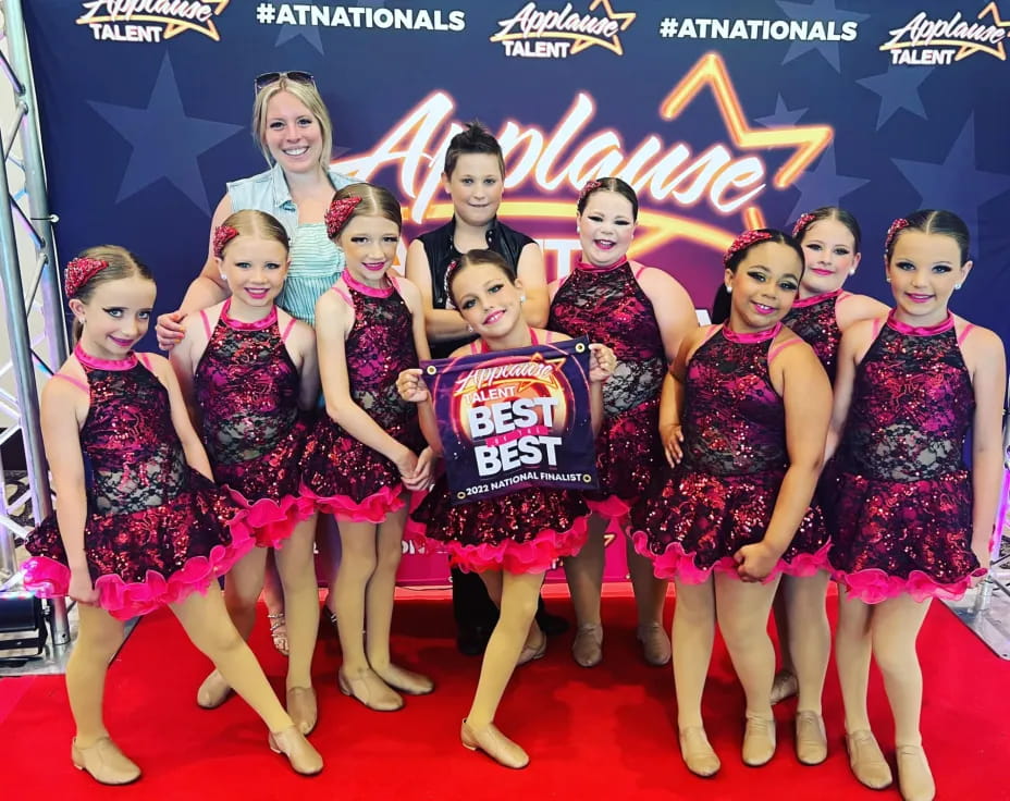 a group of women posing for a photo