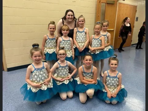 a group of girls in dresses