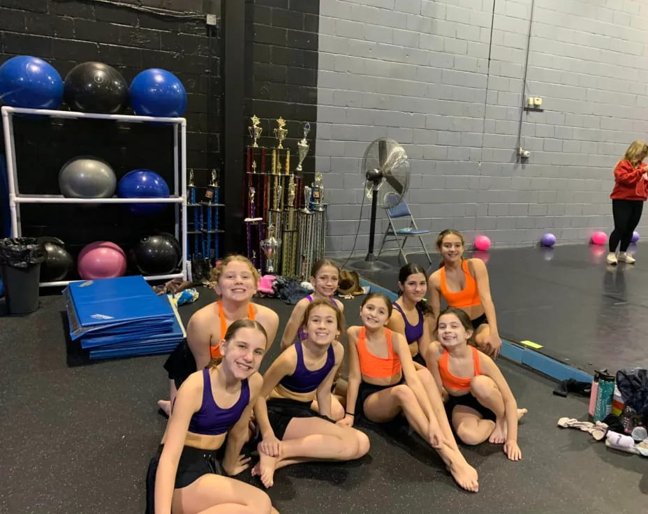 a group of women posing for a photo